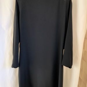 Silk shantung with low-cut back. Back zipper. Length 34” shoulder to hem.